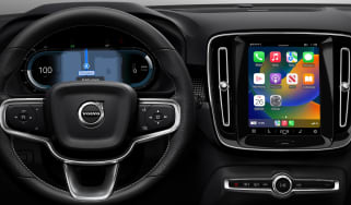 Volvo dashboard with infotainment screen displaying Apple CarPlay homescreen
